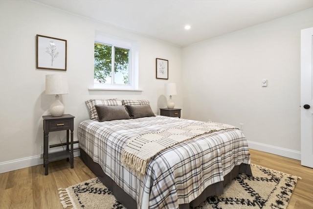 34 Bayview Ter Unit 3, Danvers, MA 01923 - bedroom featuring baseboards, light wood finished floors, baseboard heating, and recessed lighting