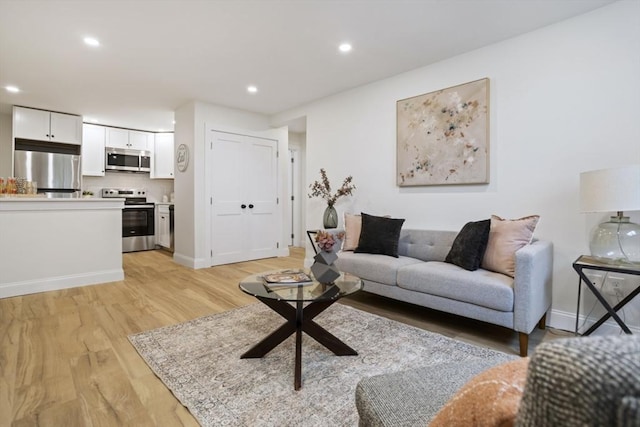 34 Bayview Ter Unit 3, Danvers, MA 01923 - living area with light wood-style flooring, recessed lighting, and baseboards