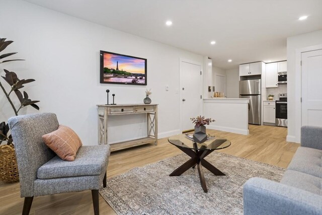34 Bayview Ter Unit 3, Danvers, MA 01923 - living area with light wood finished floors, recessed lighting, and baseboards