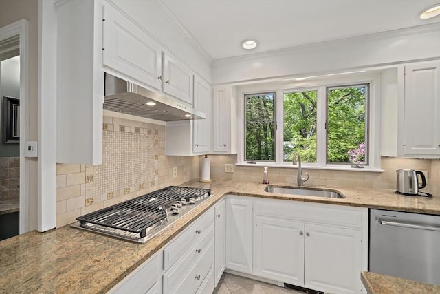 19 Ridge Rd, Newton, MA 02468 - kitchen with under cabinet range hood, a sink, appliances with stainless steel finishes, white cabinets, and decorative backsplash
