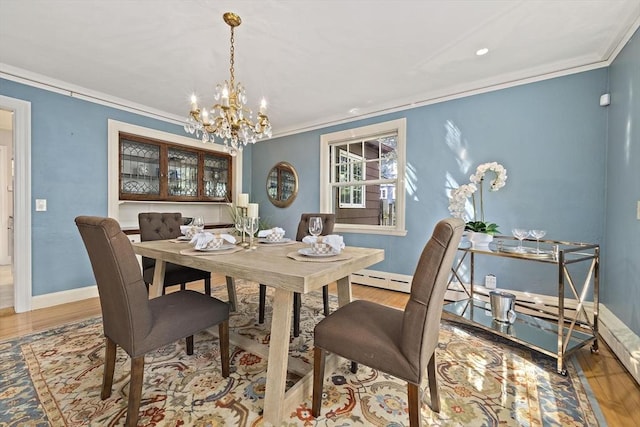 19 Ridge Rd, Newton, MA 02468 - dining room with wood finished floors, crown molding, a chandelier, baseboards, and recessed lighting