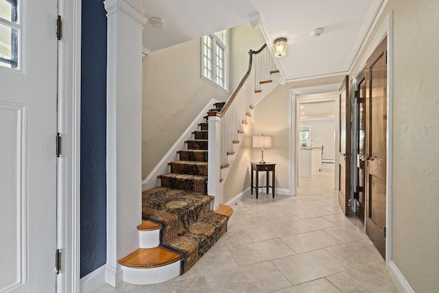 19 Ridge Rd, Newton, MA 02468 - entryway featuring healthy amount of natural light, stairway, light tile patterned floors, and a textured wall