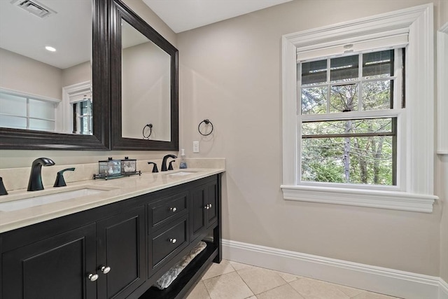 19 Ridge Rd, Newton, MA 02468 - full bathroom featuring tile patterned floors, double vanity, and baseboards