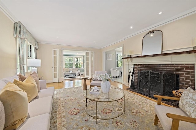 19 Ridge Rd, Newton, MA 02468 - living area featuring ornamental molding, a brick fireplace, light wood-style flooring, recessed lighting, and baseboards