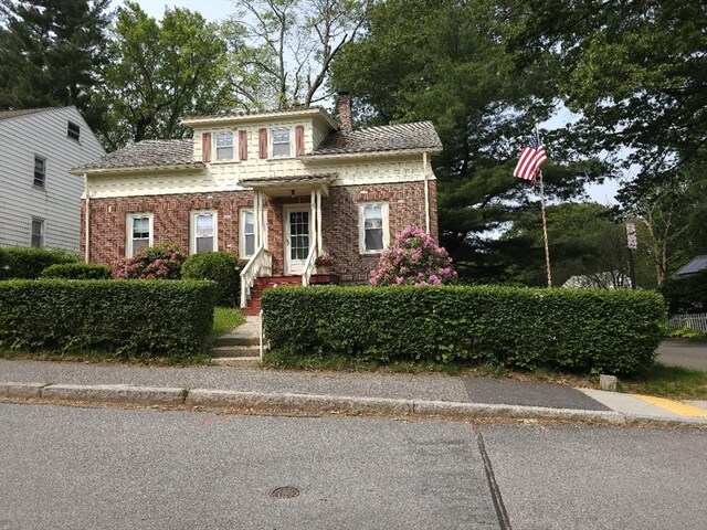 45 Circuit Ave E, Worcester, MA 01603 - view of front of house with a chimney and brick siding