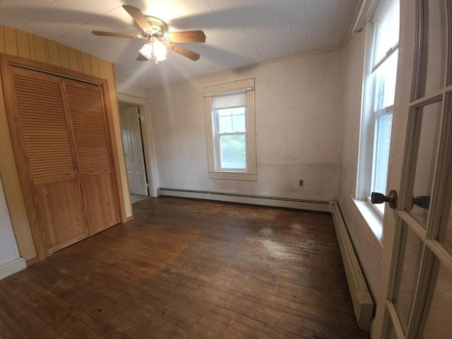 45 Circuit Ave E, Worcester, MA 01603 - unfurnished bedroom with a baseboard radiator, wood finished floors, a closet, and ceiling fan