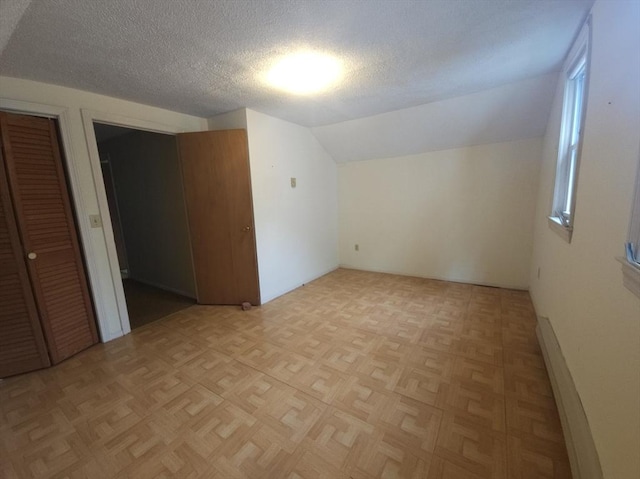 45 Circuit Ave E, Worcester, MA 01603 - additional living space with lofted ceiling and a textured ceiling