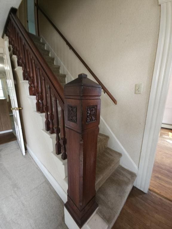 45 Circuit Ave E, Worcester, MA 01603 - stairs with baseboards and wood finished floors