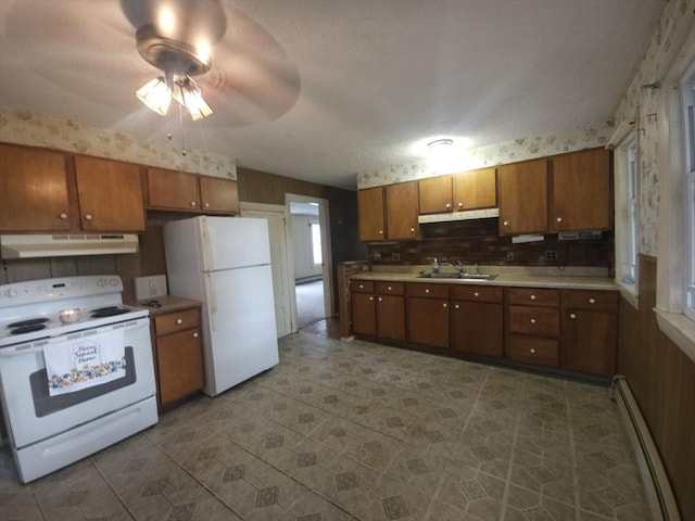 45 Circuit Ave E, Worcester, MA 01603 - kitchen with white appliances, baseboard heating, under cabinet range hood, ceiling fan, and light countertops