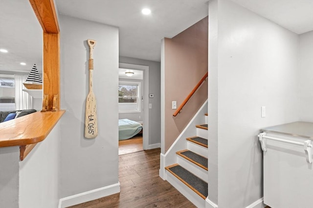 stairs with recessed lighting, baseboards, and wood finished floors