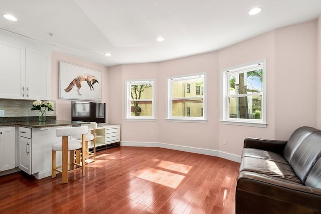 106 Walnut St Unit 2, Somerville, MA 02145 - living area featuring baseboards, wood finished floors, recessed lighting, and a desk
