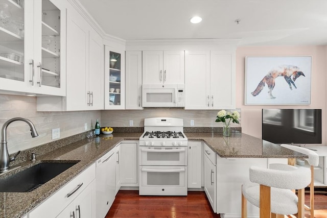 106 Walnut St Unit 2, Somerville, MA 02145 - kitchen featuring white appliances, a sink, white cabinets, and recessed lighting