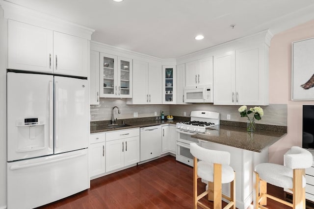 106 Walnut St Unit 2, Somerville, MA 02145 - kitchen featuring white appliances, a sink, white cabinets, glass insert cabinets, and recessed lighting