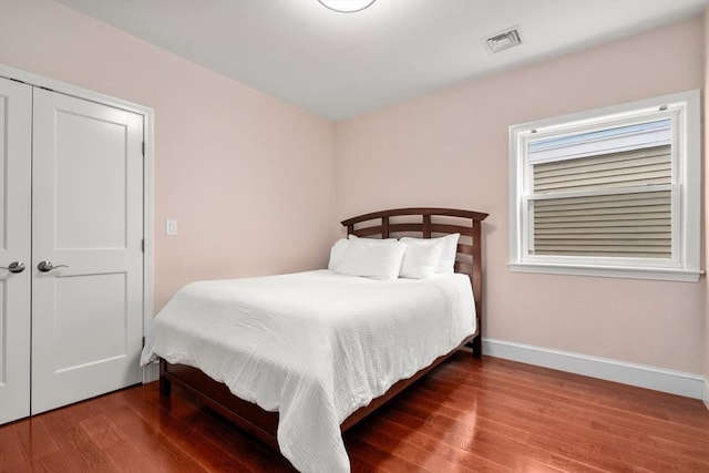 106 Walnut St Unit 2, Somerville, MA 02145 - bedroom with wood finished floors, baseboards, and a closet