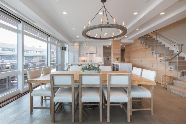 dining room featuring a chandelier, wood-type flooring, and sink