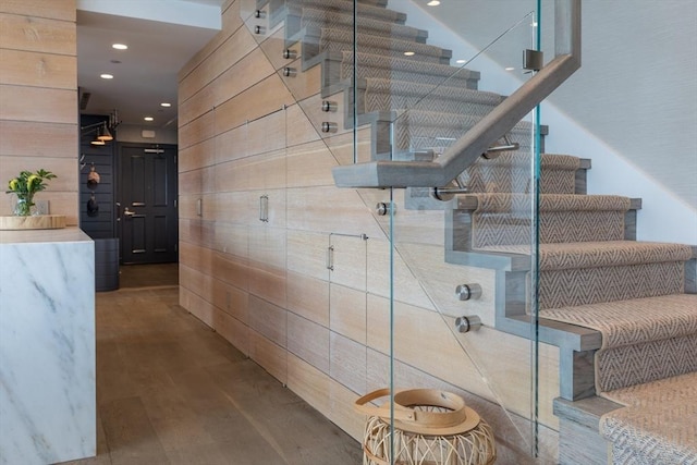 staircase featuring hardwood / wood-style floors