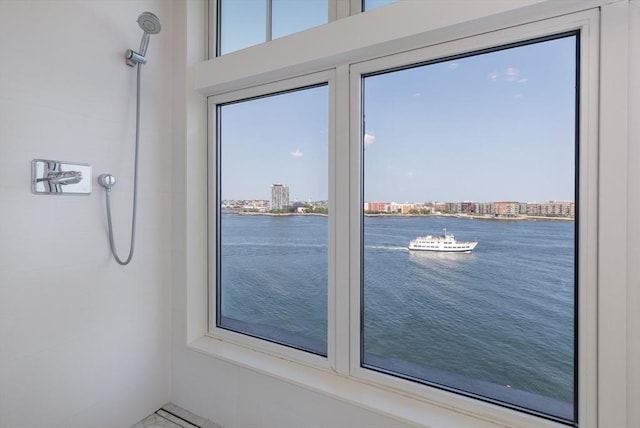 doorway to outside featuring a water view