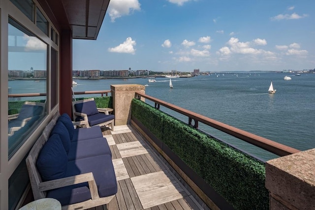 balcony featuring a water view