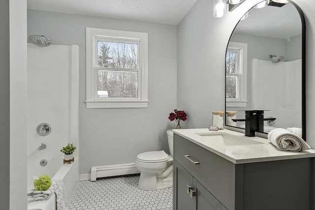 bathroom featuring a baseboard heating unit, baseboards, shower / washtub combination, toilet, and vanity