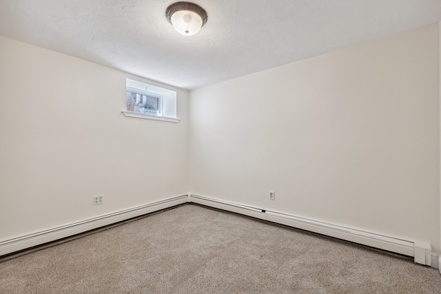 empty room featuring carpet and a textured ceiling