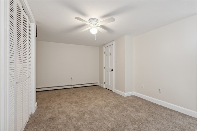 unfurnished bedroom with light carpet, ceiling fan, and a baseboard heating unit