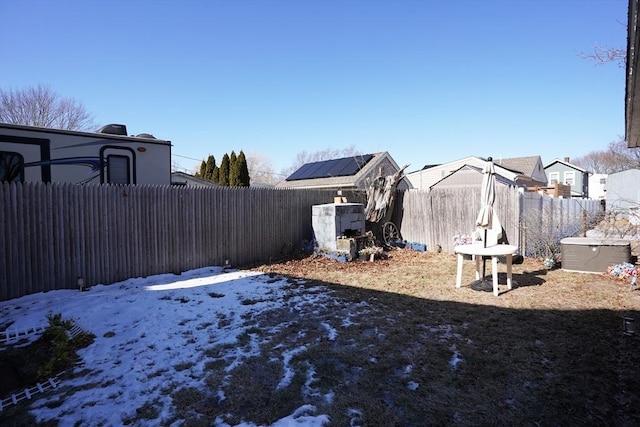 yard covered in snow featuring a fenced backyard