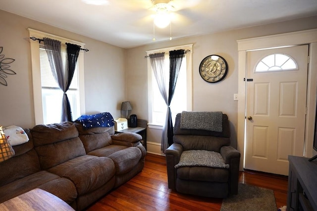 living area featuring hardwood / wood-style flooring and ceiling fan