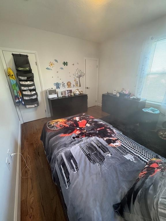 bedroom featuring dark hardwood / wood-style floors