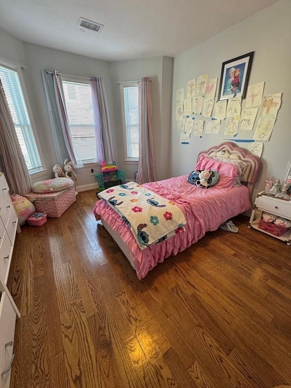 bedroom with hardwood / wood-style flooring