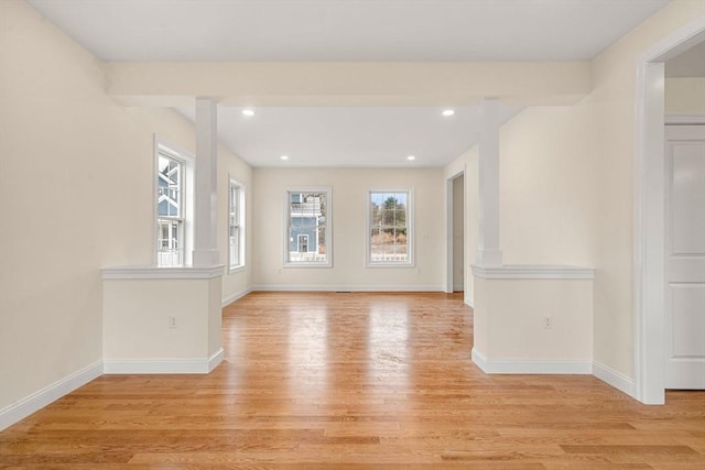 spare room with recessed lighting, light wood-style flooring, and baseboards