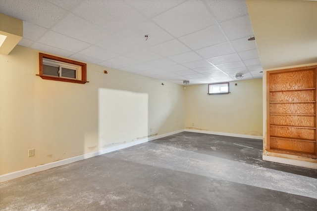 basement featuring a drop ceiling