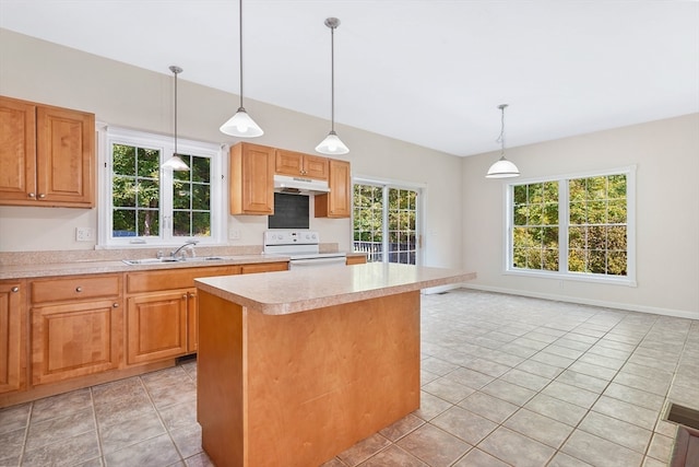 kitchen featuring a center island, white range oven, a healthy amount of sunlight, and sink