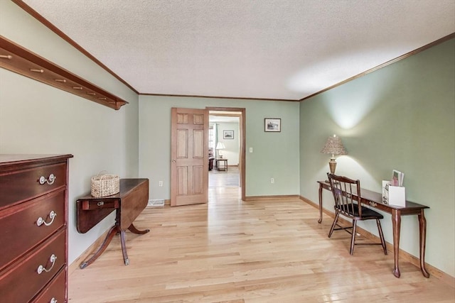 49 Lady Slipper Dr, Dennis, MA 02638 - office with crown molding, a textured ceiling, light wood-style flooring, and baseboards