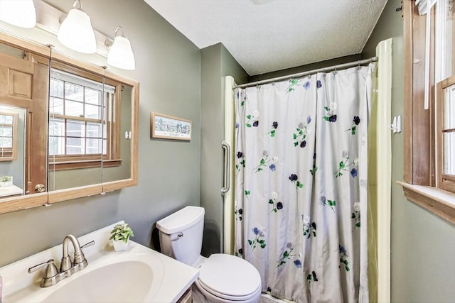 49 Lady Slipper Dr, Dennis, MA 02638 - full bath with toilet, a shower with curtain, a textured ceiling, and vanity