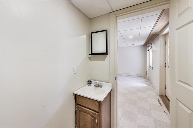 49 Lady Slipper Dr, Dennis, MA 02638 - bathroom with a paneled ceiling, vanity, baseboards, tile patterned floors, and recessed lighting