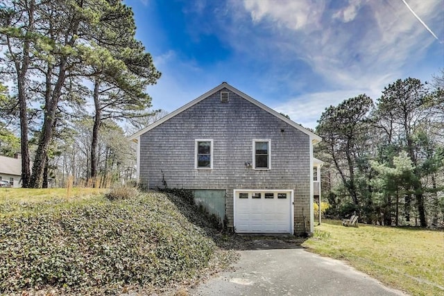 49 Lady Slipper Dr, Dennis, MA 02638 - view of home's exterior with a yard, an attached garage, and driveway