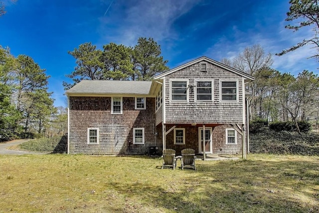 49 Lady Slipper Dr, Dennis, MA 02638 - rear view of property with a yard