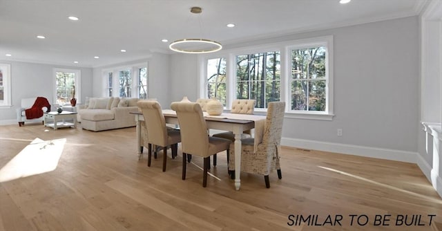 10 Webber Ave Unit 4D, Bedford, MA 01730 - dining space featuring crown molding, baseboards, recessed lighting, and light wood-type flooring