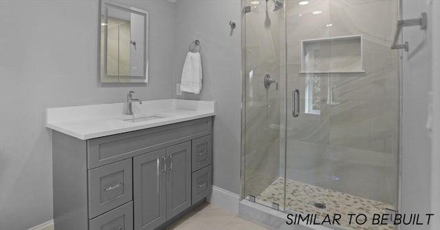 10 Webber Ave Unit 4D, Bedford, MA 01730 - full bathroom featuring a stall shower, vanity, and baseboards