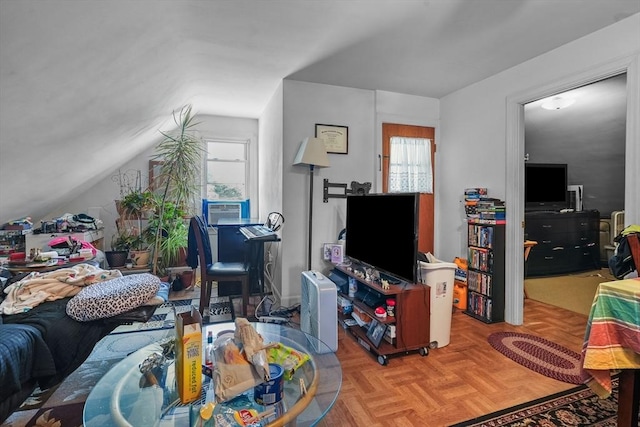 living room with light parquet flooring, cooling unit, and lofted ceiling