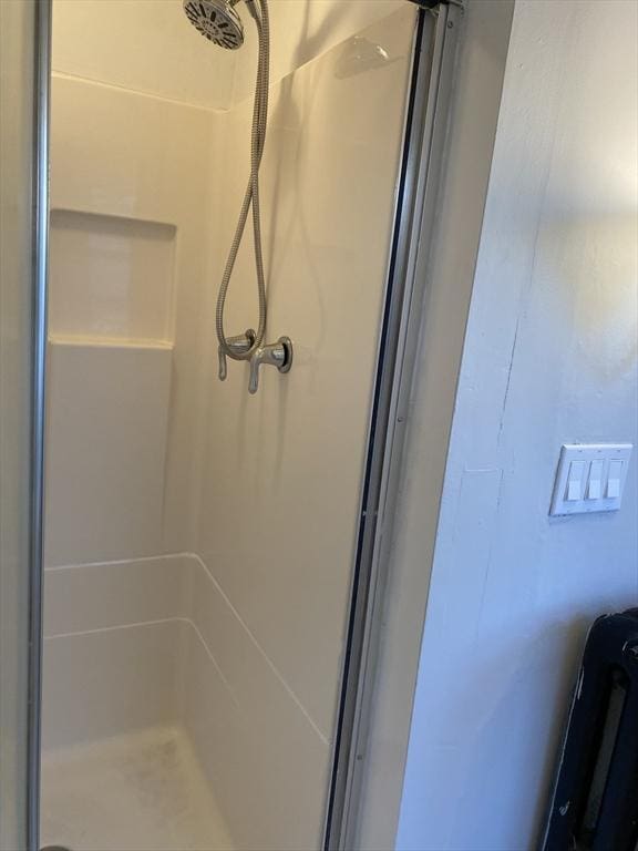 bathroom featuring walk in shower