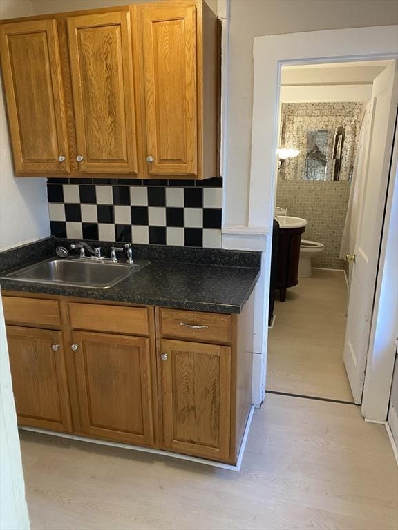 kitchen with sink and tasteful backsplash