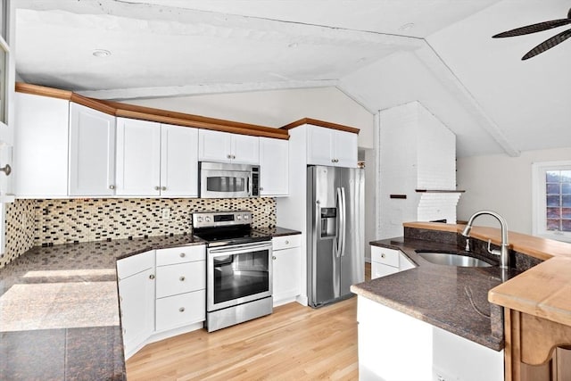 51 Shore Dr, Plymouth, MA 02360 - kitchen with stainless steel appliances, a sink, lofted ceiling, ceiling fan, and backsplash