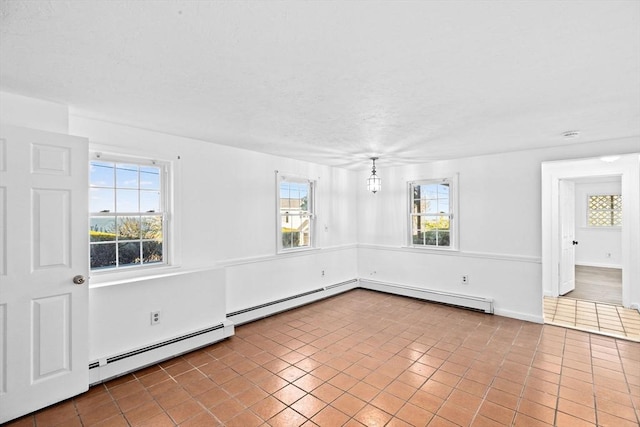 51 Shore Dr, Plymouth, MA 02360 - tiled spare room featuring a baseboard heating unit, healthy amount of natural light, and a baseboard radiator