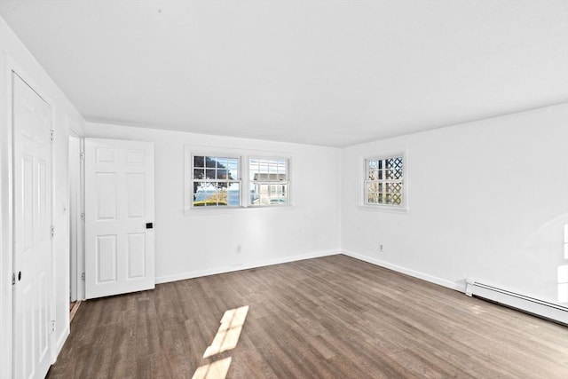 51 Shore Dr, Plymouth, MA 02360 - spare room featuring wood finished floors, baseboard heating, and baseboards