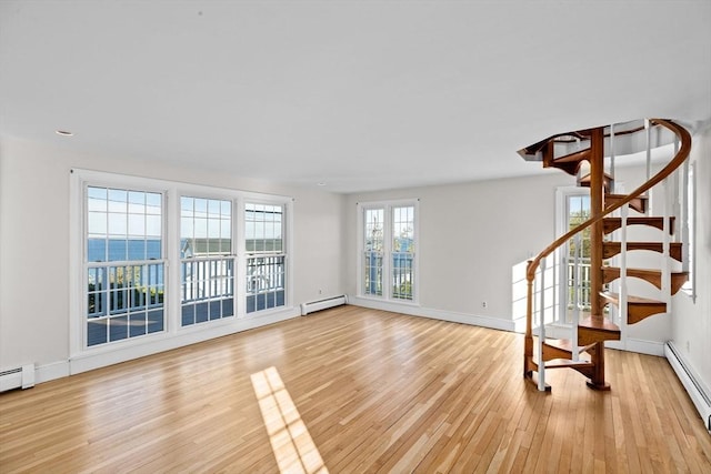 51 Shore Dr, Plymouth, MA 02360 - unfurnished living room featuring baseboard heating, light wood finished floors, stairway, and baseboards