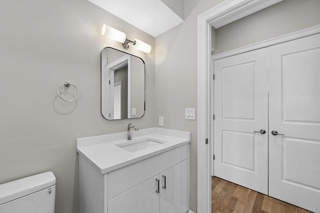 42 Waverly Unit 1, Boston, MA 02135 - bathroom featuring vanity, wood finished floors, and toilet