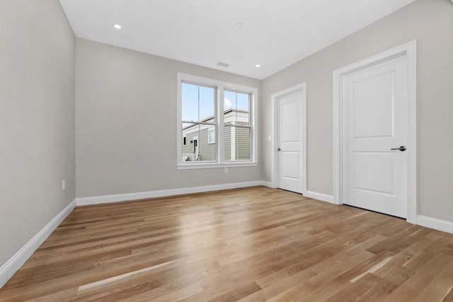 42 Waverly Unit 1, Boston, MA 02135 - unfurnished bedroom with baseboards and light wood-style flooring