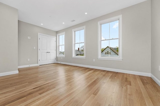 42 Waverly Unit 1, Boston, MA 02135 - unfurnished room with light wood-style flooring, baseboards, and recessed lighting