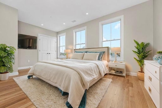 42 Waverly Unit 1, Boston, MA 02135 - bedroom featuring baseboards, light wood-style floors, a closet, and recessed lighting